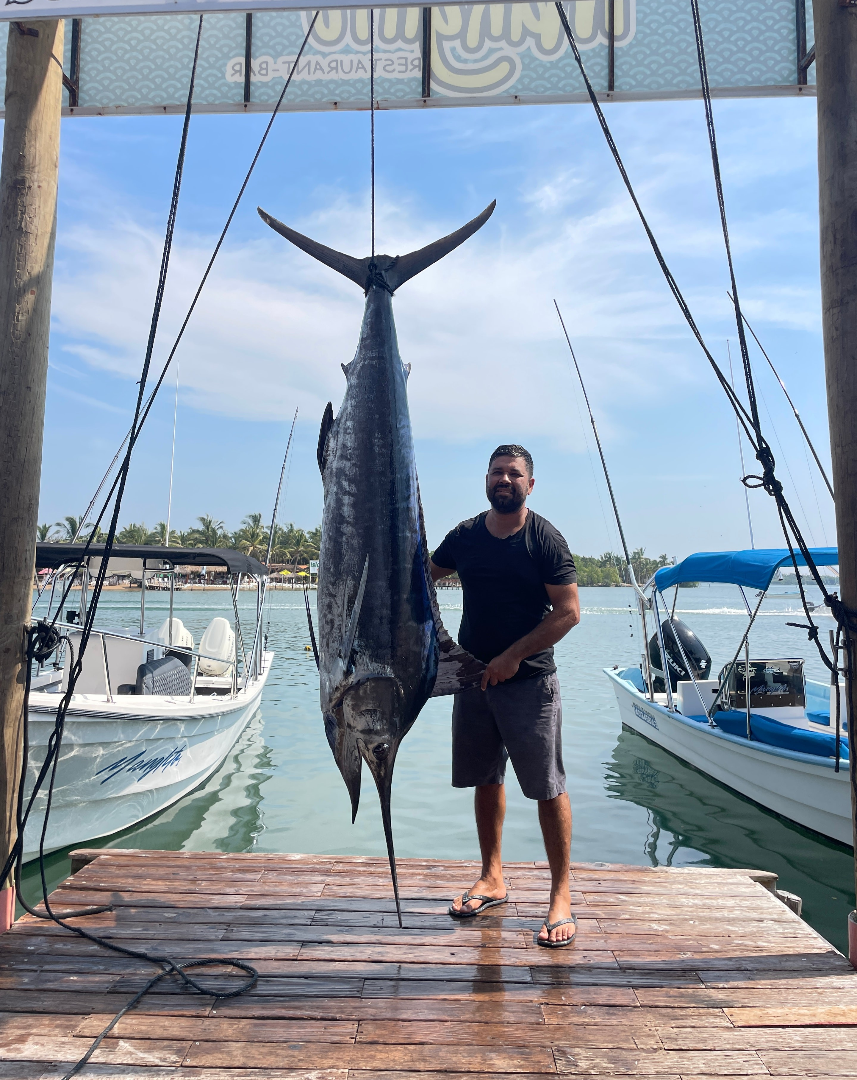 Happy fishing charter guests with trophy fish